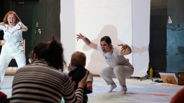 Performers at the event Big Dreams: Dancing with Colours dressed in white dungarees.