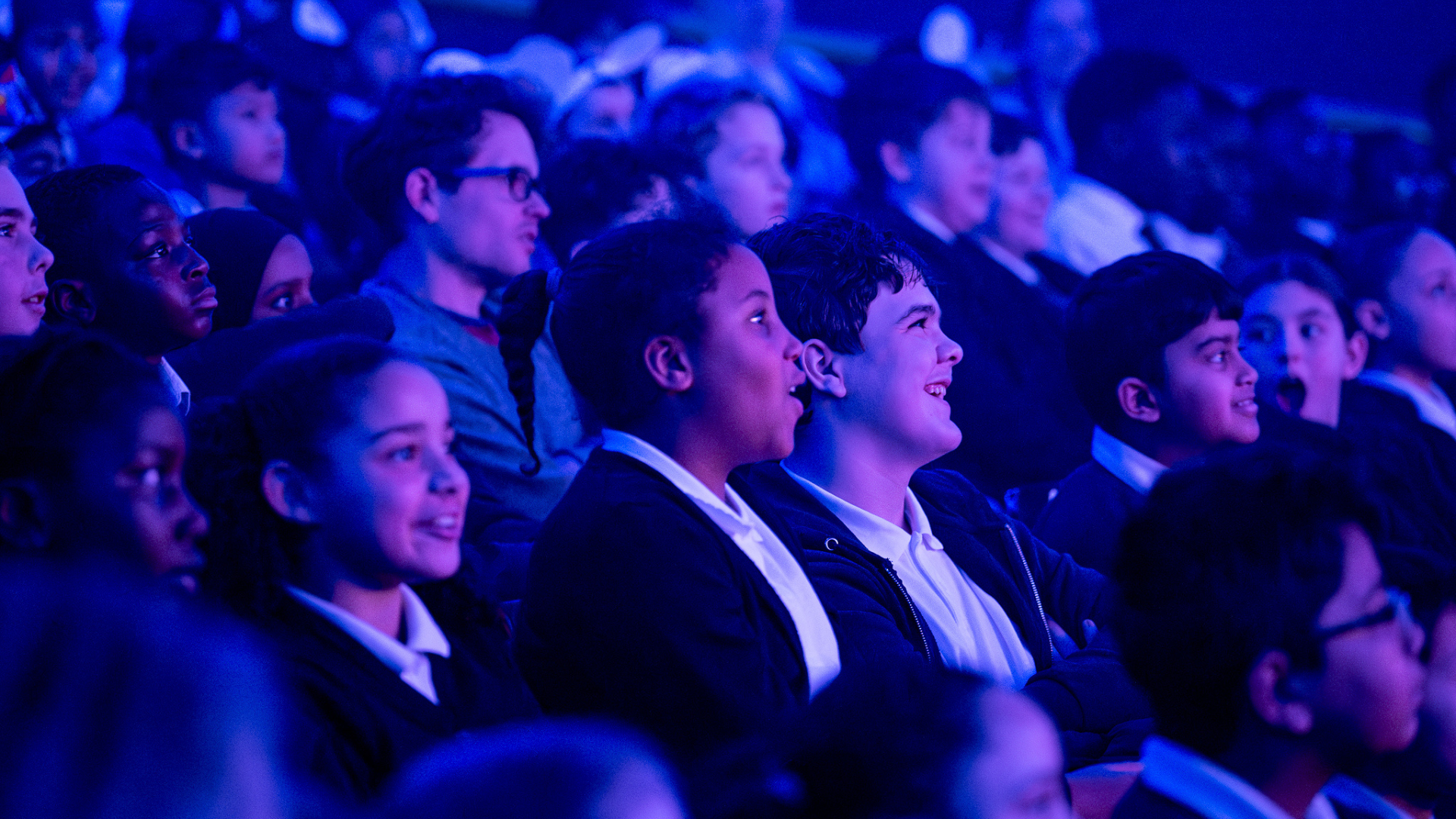 An image of the audience looking engaged during a performance.