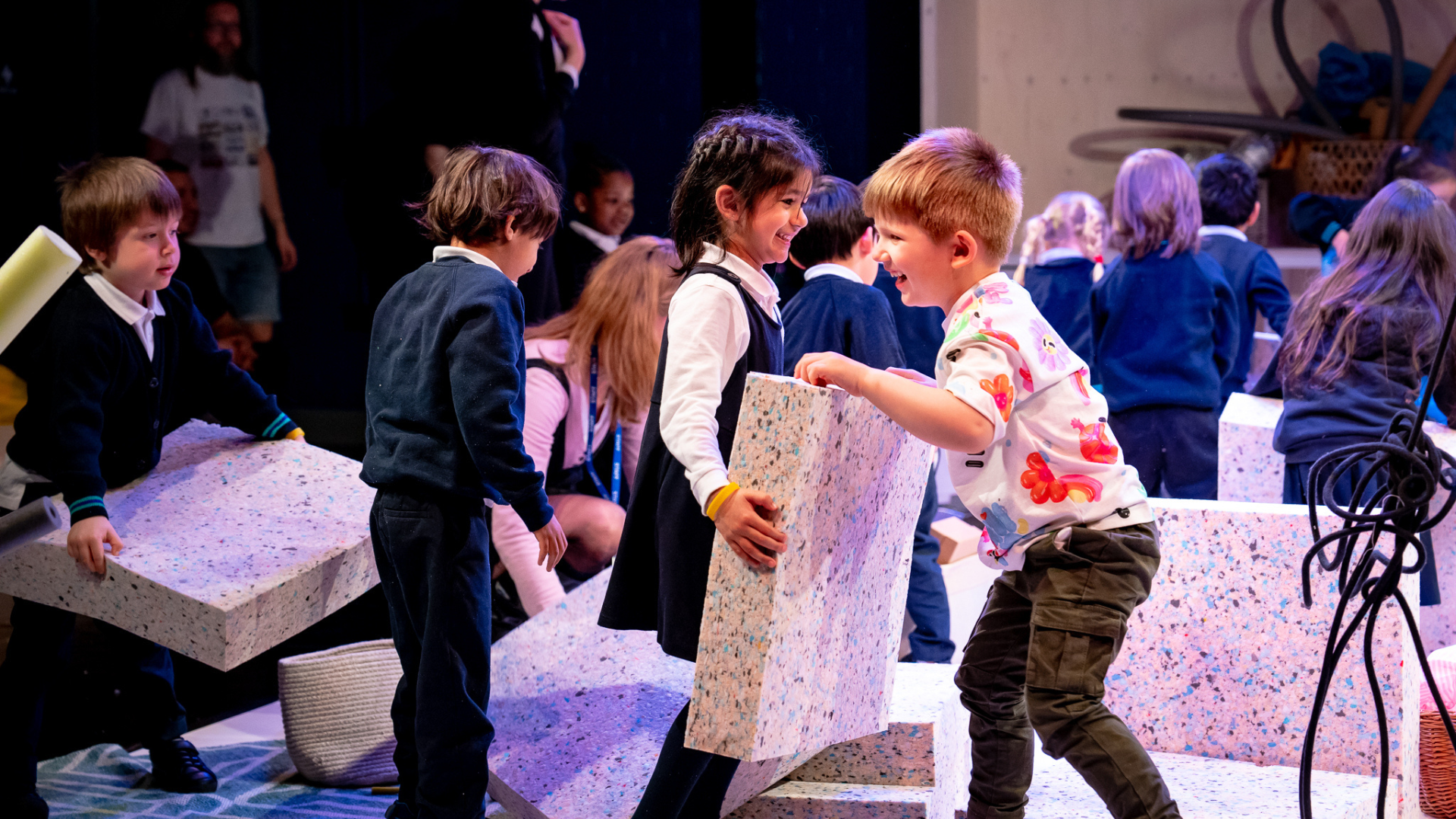 A group of children holding sponge blocks.