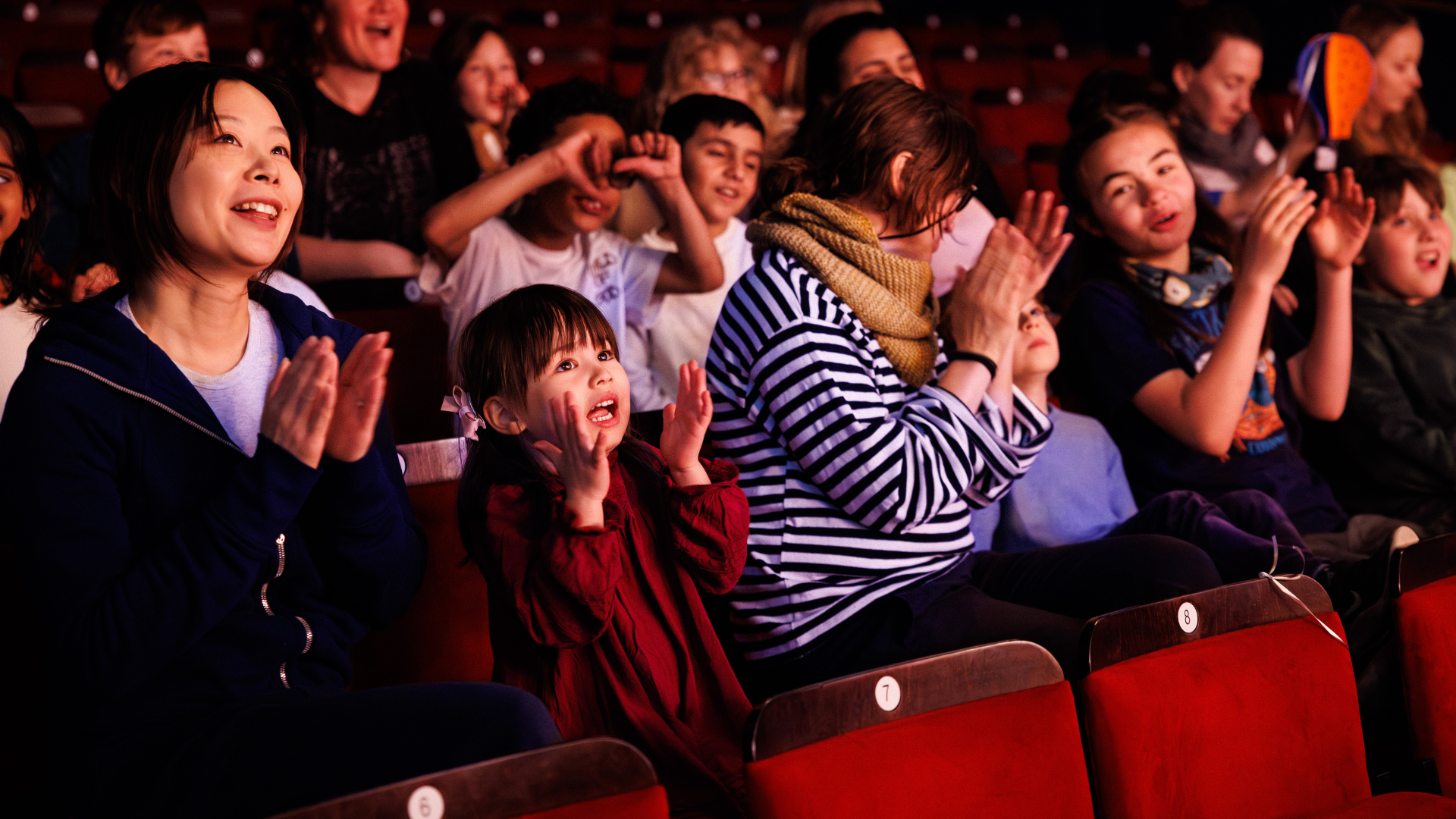 Parents sat in the audience with their children looking engaged with the performance.