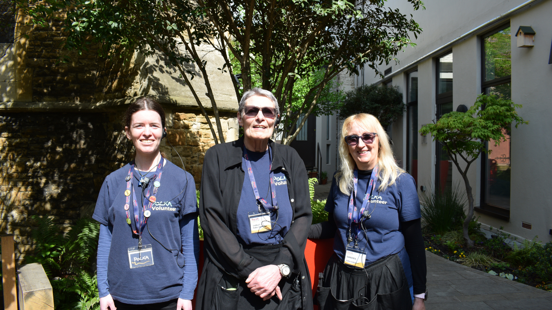A shot of the Polka team members stood outside in the sunshine.